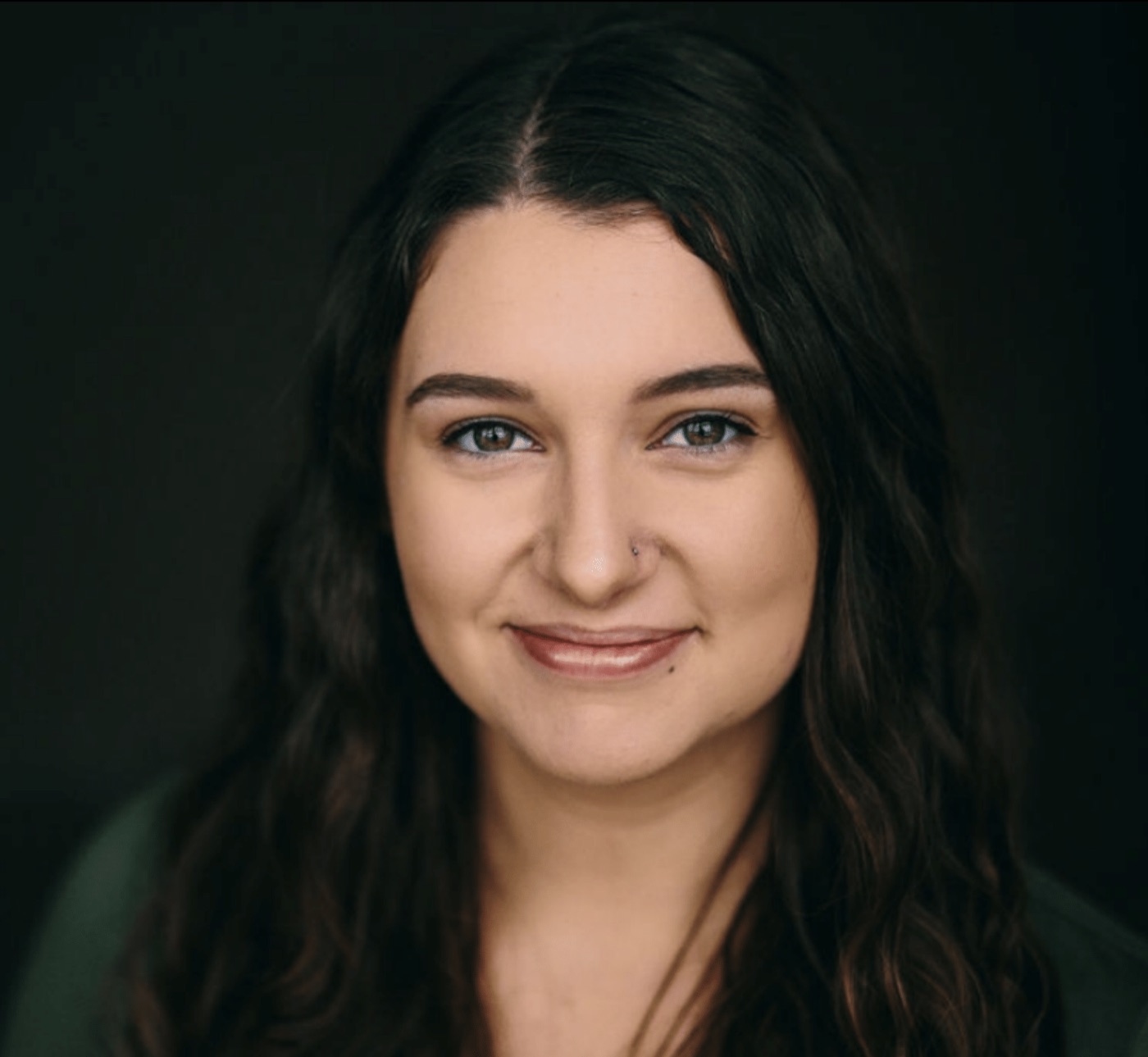 Caitlyn Sarafa, founder of Marigold Voice Studio, smiling